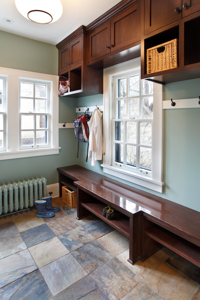 Inspiration for a mid-sized traditional mudroom in Minneapolis with grey walls and slate floors.