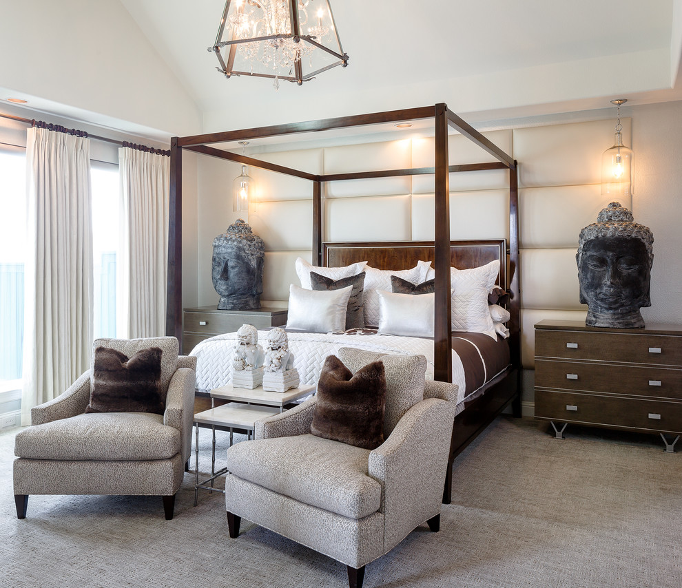 This is an example of a transitional bedroom in Dallas with beige walls and carpet.