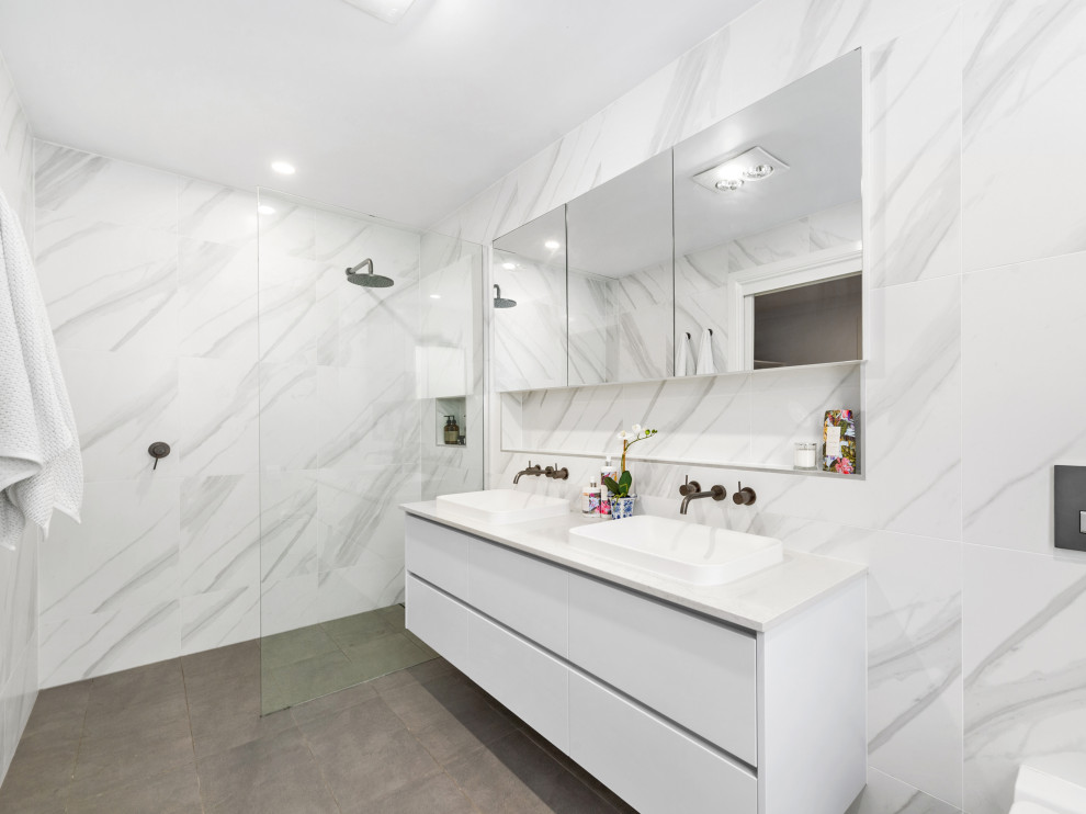 Inspiration for a mid-sized beach style master bathroom in Brisbane with white cabinets, an open shower, a wall-mount toilet, a drop-in sink, engineered quartz benchtops, an open shower, white benchtops, a niche, a double vanity, a floating vanity and flat-panel cabinets.