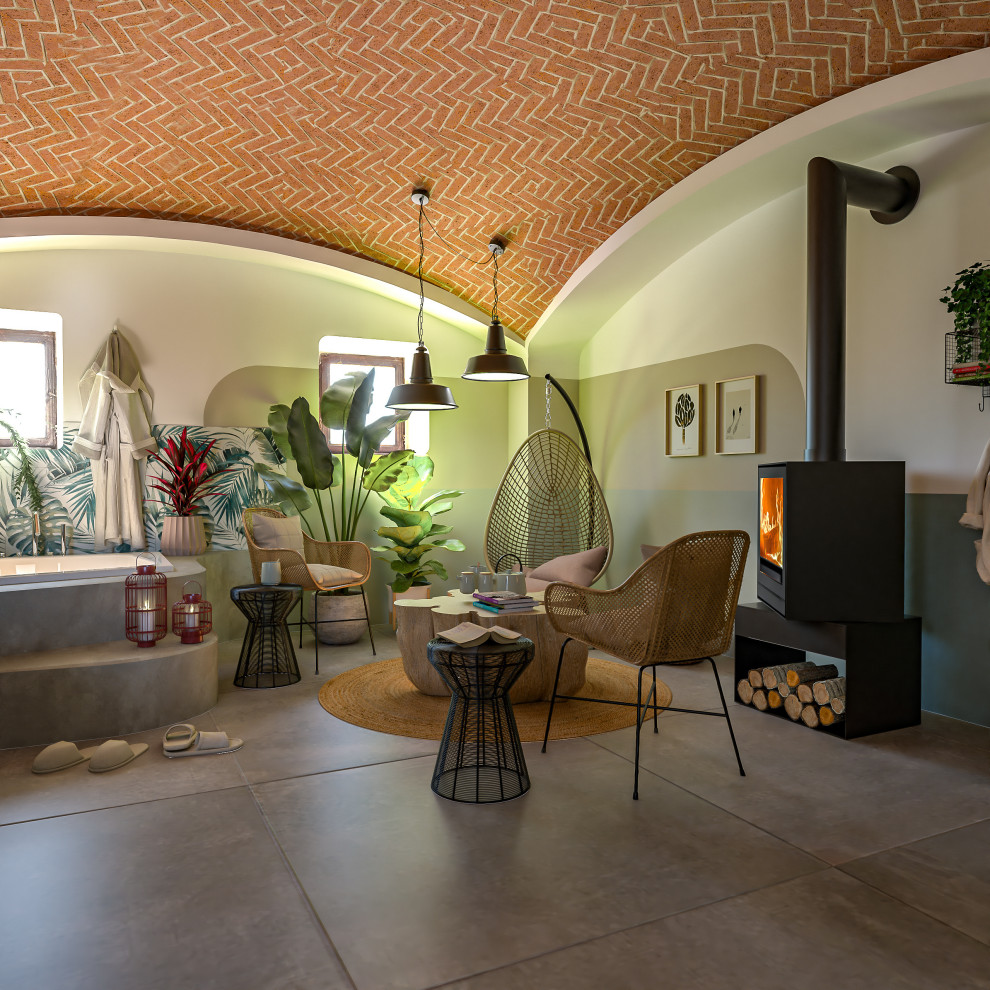 Inspiration for a mid-sized industrial walk-out basement in Milan with multi-coloured walls, porcelain floors, a wood stove, a metal fireplace surround, grey floor and vaulted.