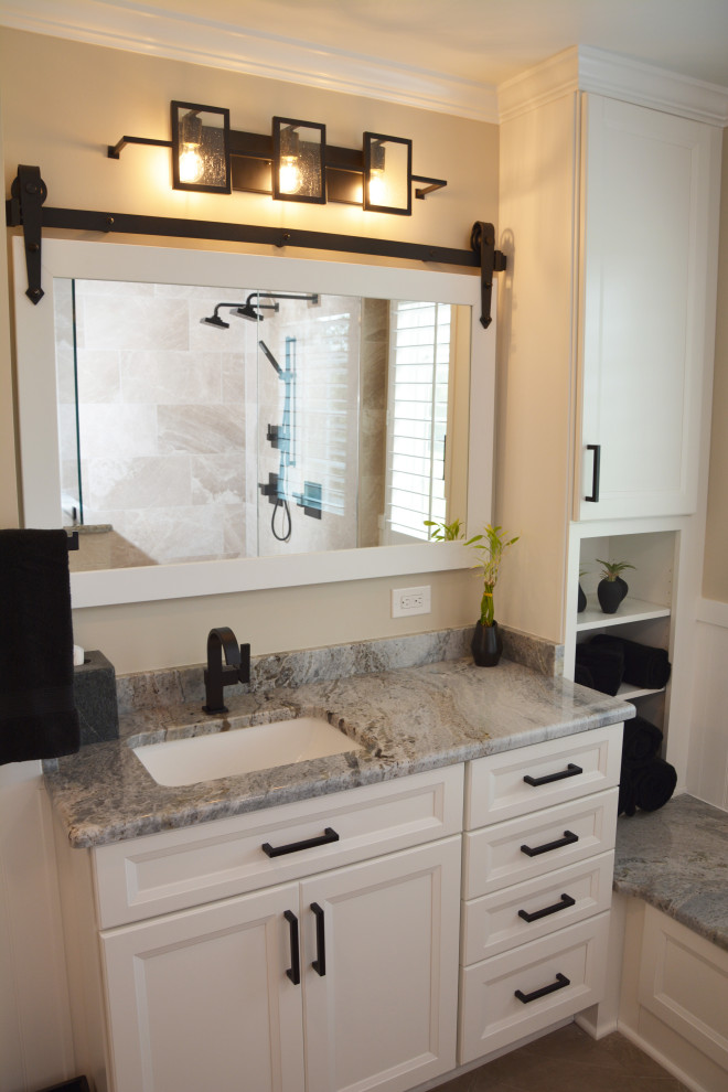 Mid-sized transitional master bathroom in DC Metro with recessed-panel cabinets, white cabinets, an alcove shower, a two-piece toilet, beige walls, an undermount sink, granite benchtops, beige floor, an open shower, grey benchtops, a double vanity and a built-in vanity.