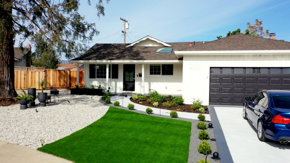 Inspiration for a modern front yard driveway in San Francisco with with path and gravel.