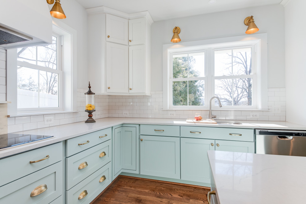Large cottage l-shaped medium tone wood floor and brown floor kitchen pantry photo in DC Metro with an undermount sink, shaker cabinets, blue cabinets, quartz countertops, white backsplash, subway tile backsplash, stainless steel appliances, an island and white countertops