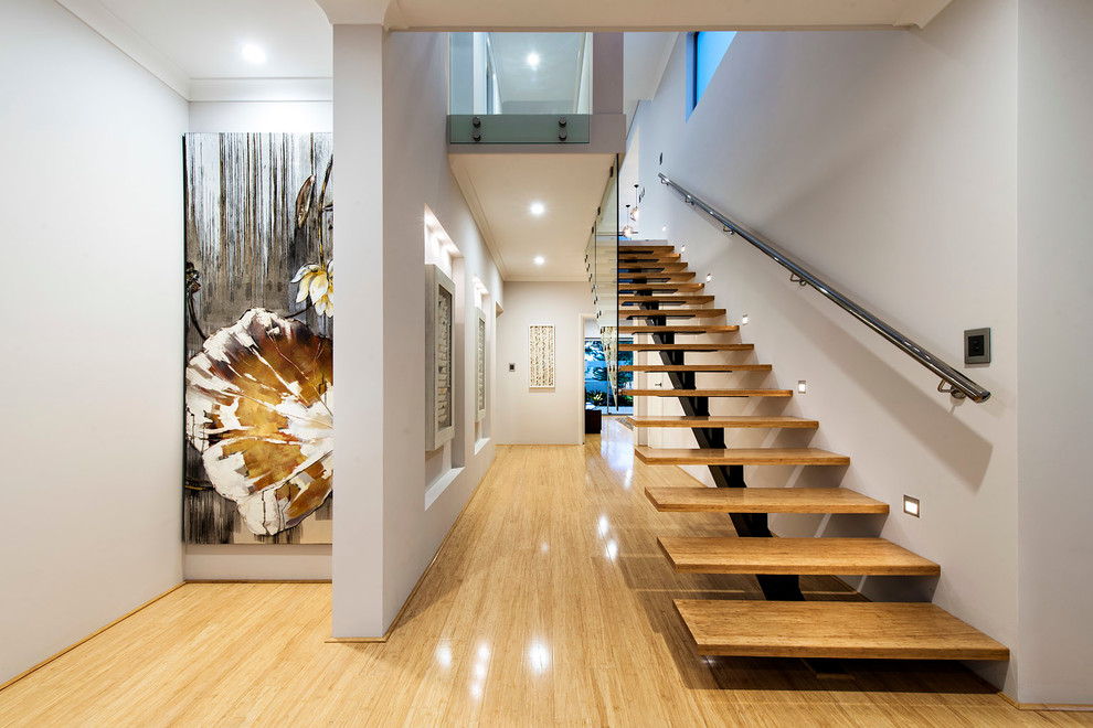 Inspiration for a mid-sized contemporary wood straight staircase in Perth with open risers.