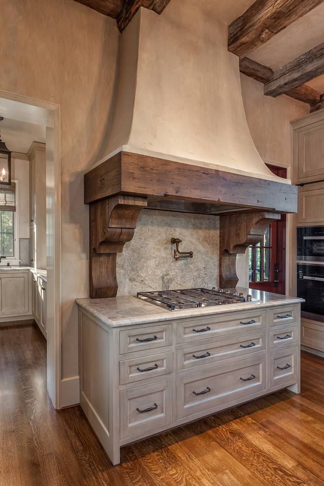 Inspiration for a large rustic galley medium tone wood floor eat-in kitchen remodel with stone slab backsplash, shaker cabinets, gray cabinets, marble countertops, gray backsplash, paneled appliances, an island and an undermount sink