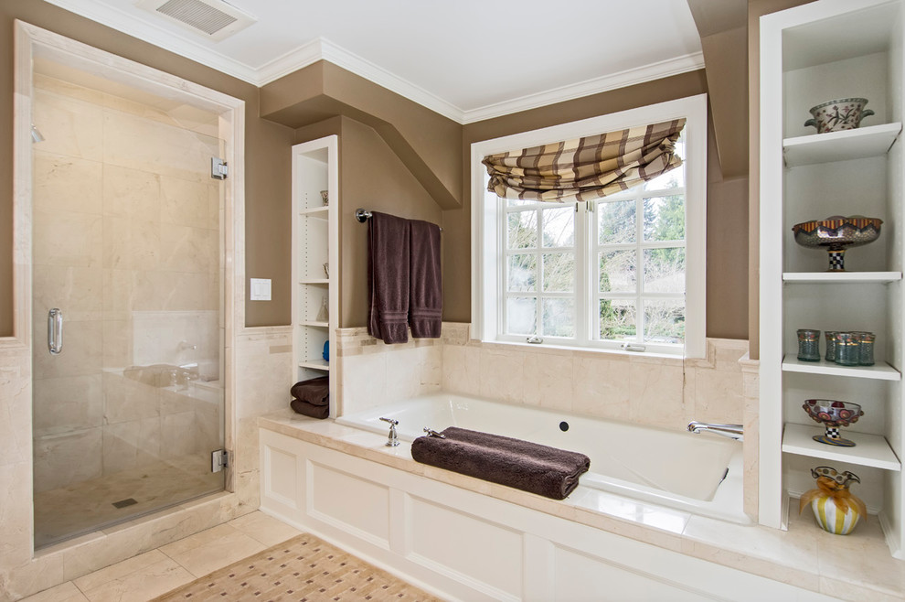Inspiration for a mid-sized traditional master bathroom in Seattle with recessed-panel cabinets, white cabinets, a drop-in tub, an alcove shower, beige tile, stone tile, beige walls, travertine floors, a drop-in sink, soapstone benchtops, beige floor, a hinged shower door and beige benchtops.