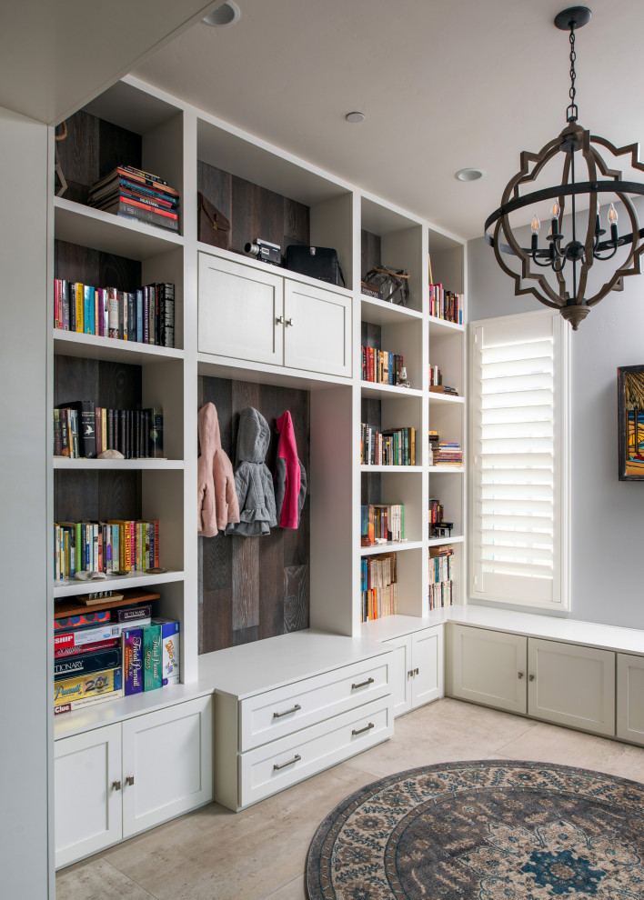 Inspiration for a transitional home office in San Diego with a library, grey walls, porcelain floors and grey floor.