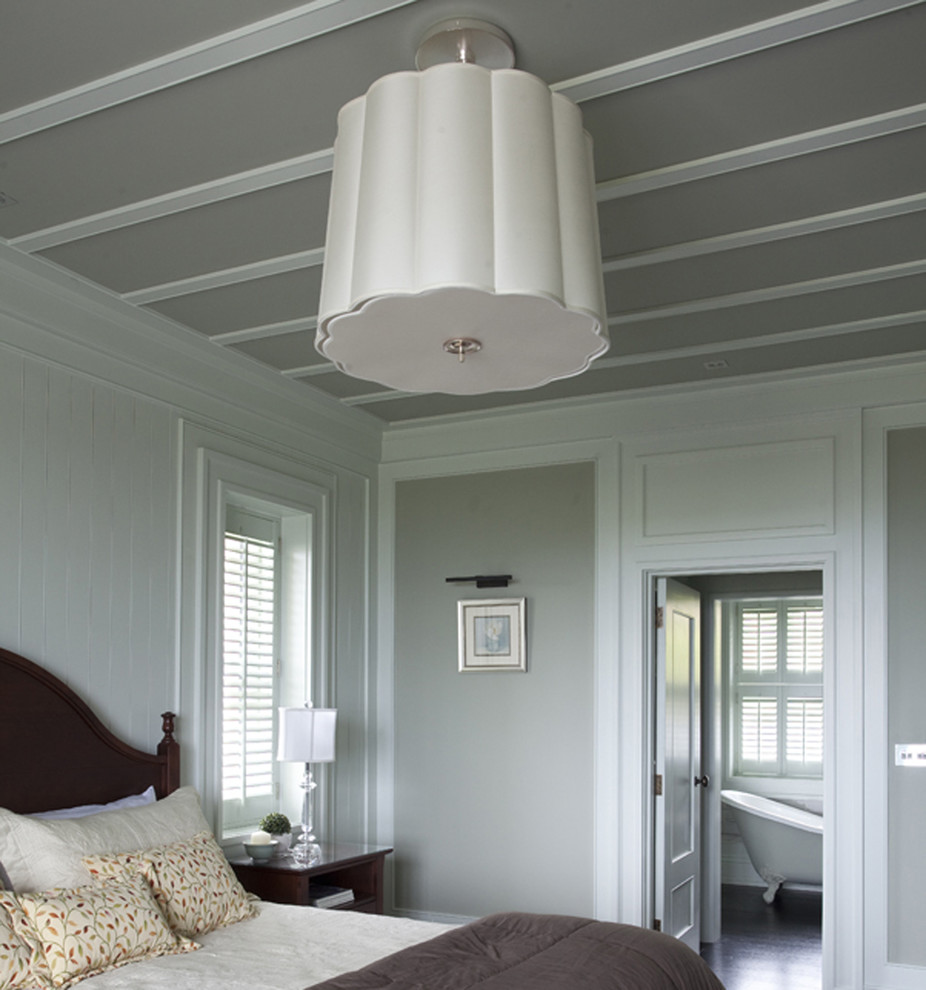 Inspiration for a traditional master bedroom in Dublin with grey walls and dark hardwood floors.
