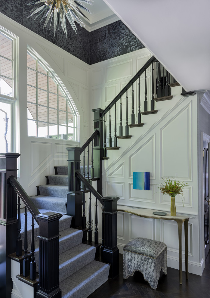 Mid-sized transitional staircase in Boston with decorative wall panelling.