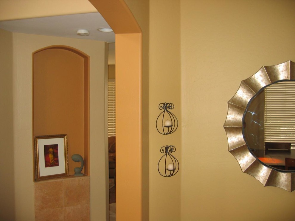Inspiration for a transitional hallway remodel with multicolored walls