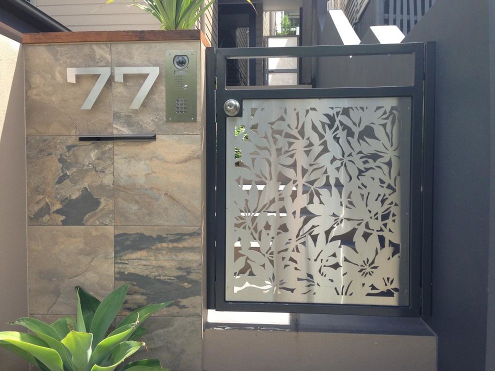 This is an example of a small contemporary entryway in Brisbane.