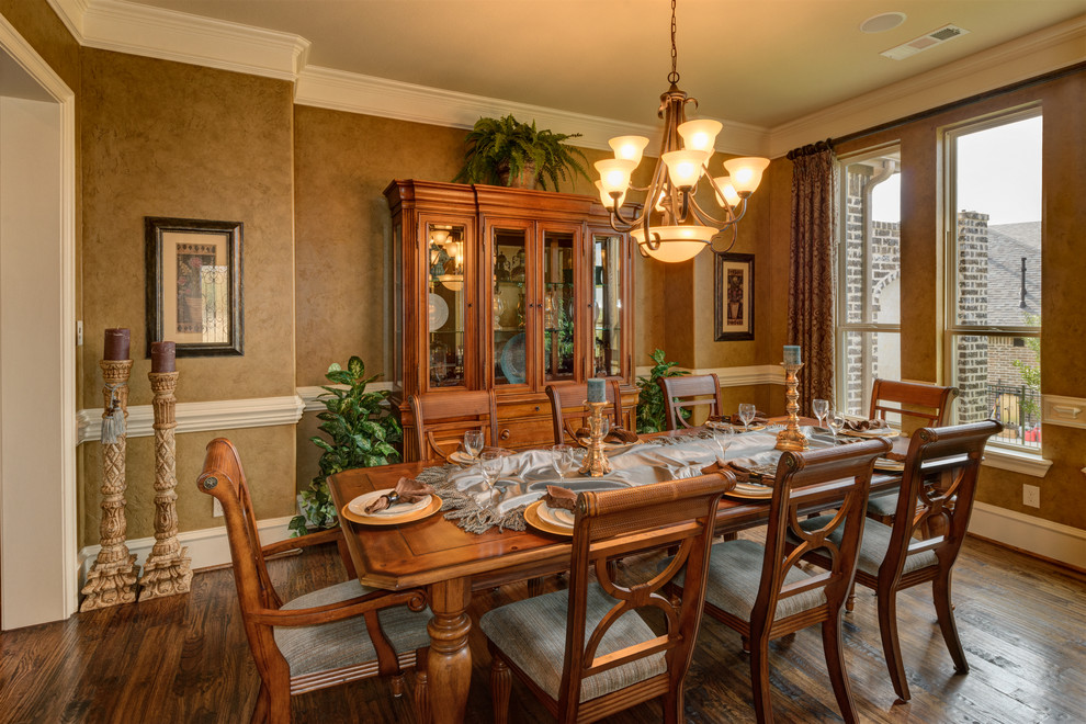This is an example of a mid-sized mediterranean open plan dining in Dallas with brown walls, medium hardwood floors and no fireplace.