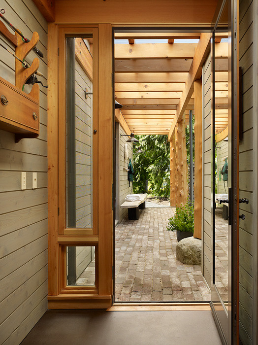 This is an example of a mid-sized country hallway in Seattle with concrete floors.