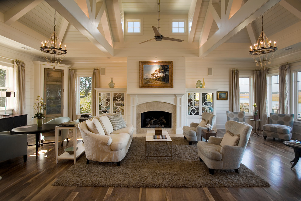 Photo of a beach style open concept living room in Charleston with white walls and medium hardwood floors.