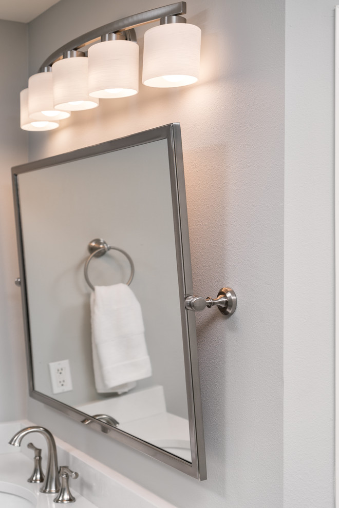 Example of a large transitional master multicolored tile and mosaic tile porcelain tile home design design with gray walls, an undermount sink and quartz countertops