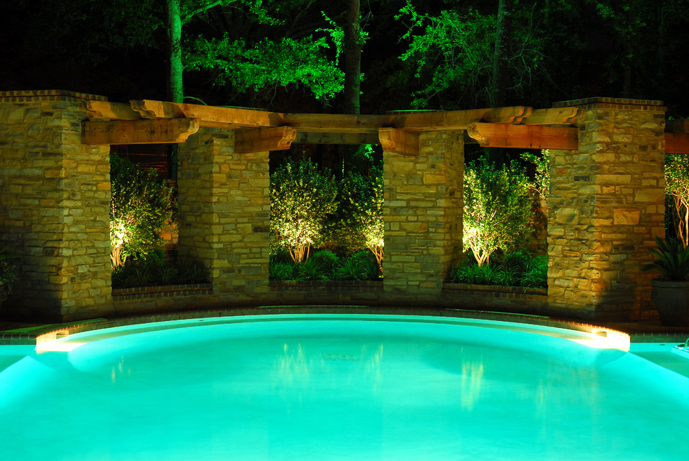 Mid-sized traditional backyard pool in Other.
