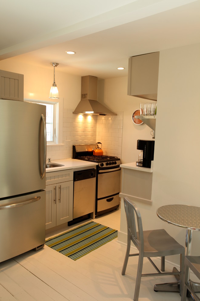This is an example of a small beach style kitchen in Philadelphia with stainless steel appliances and an undermount sink.