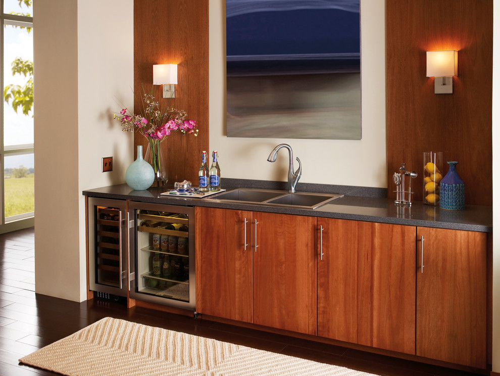 Transitional dark wood floor kitchen photo in Indianapolis with a drop-in sink, flat-panel cabinets, medium tone wood cabinets, stainless steel appliances and beige walls