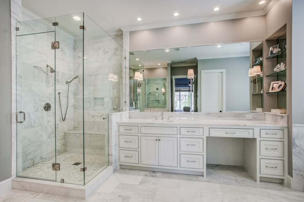 Photo of a traditional master bathroom in Dallas with beaded inset cabinets, white cabinets, a corner shower, grey walls, an undermount sink, white floor and white benchtops.