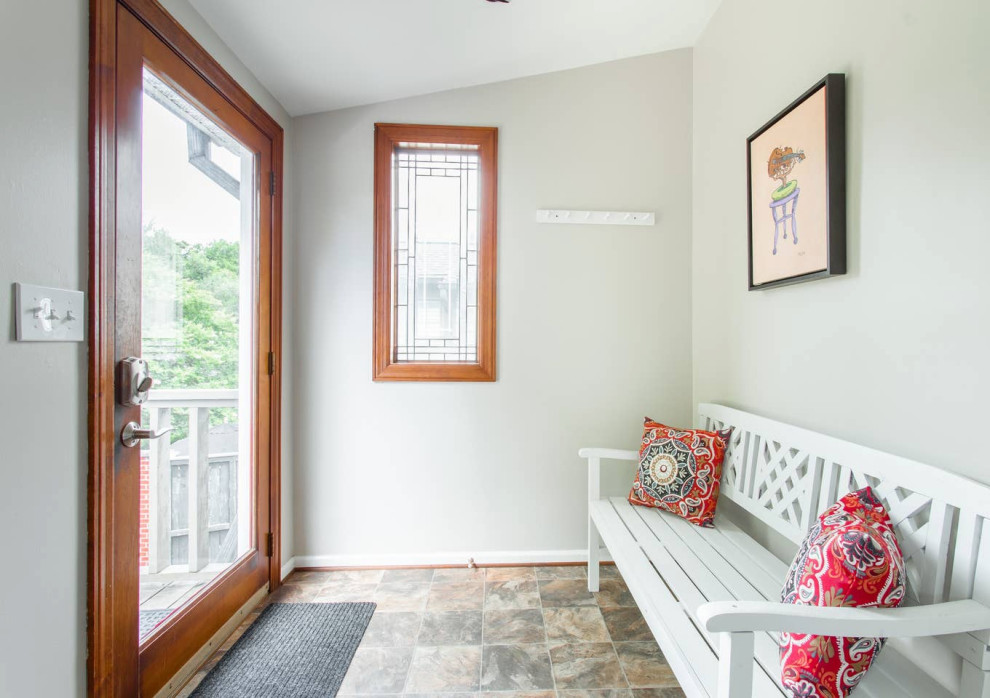 Inspiration for a mid-sized transitional front door in Nashville with beige walls, linoleum floors, a single front door, a medium wood front door and beige floor.