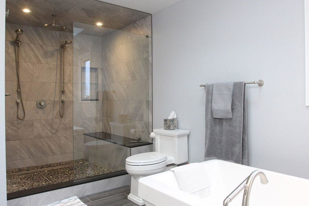 Inspiration for a large transitional master bathroom in Other with a freestanding tub, a double shower, a one-piece toilet, black and white tile, ceramic tile, grey walls, dark hardwood floors and an open shower.