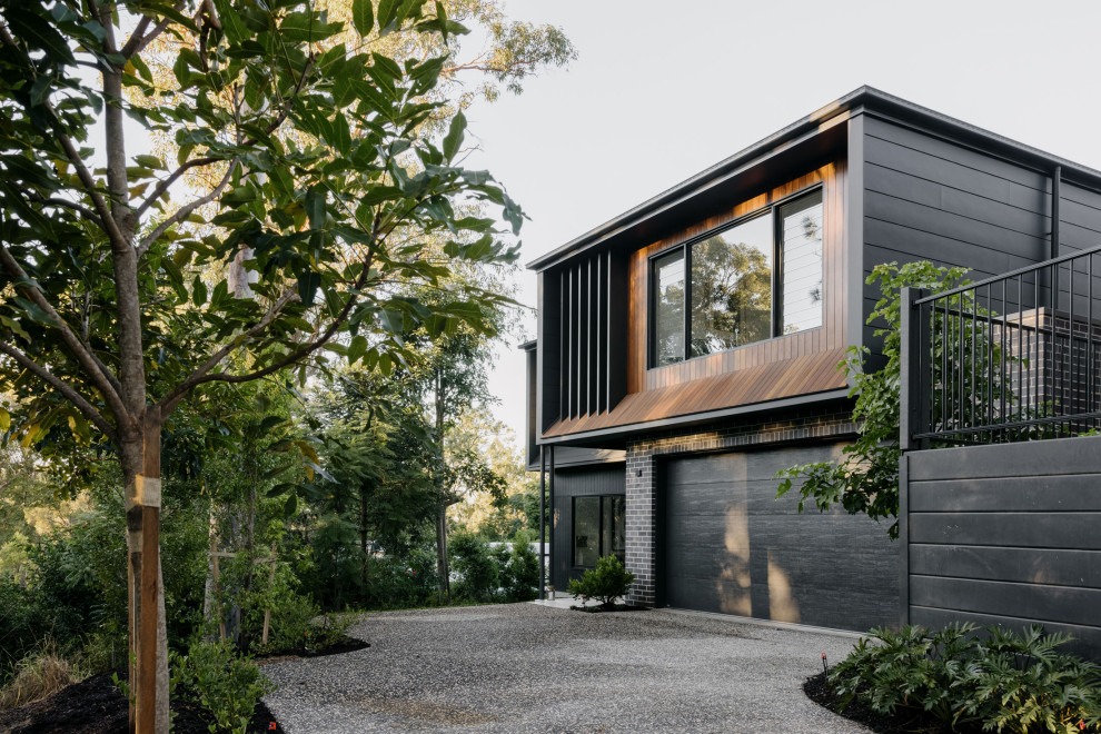 Design ideas for a contemporary two-storey house exterior in Brisbane.