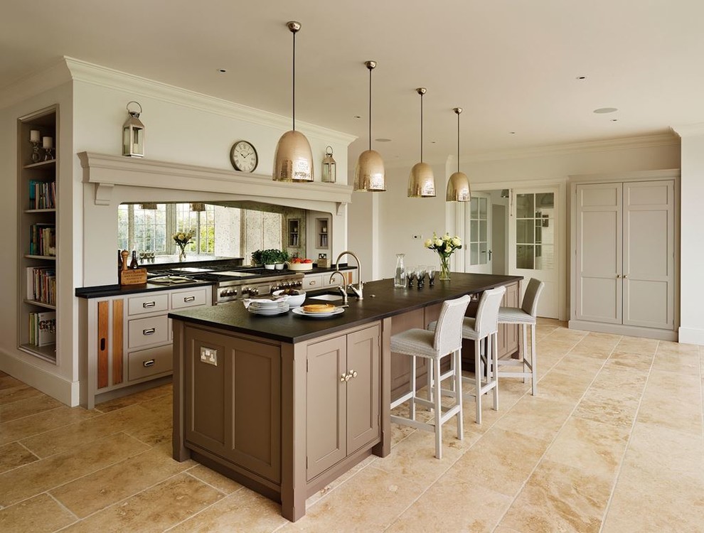 Kitchen - transitional kitchen idea with an undermount sink, brown cabinets, stainless steel appliances and an island
