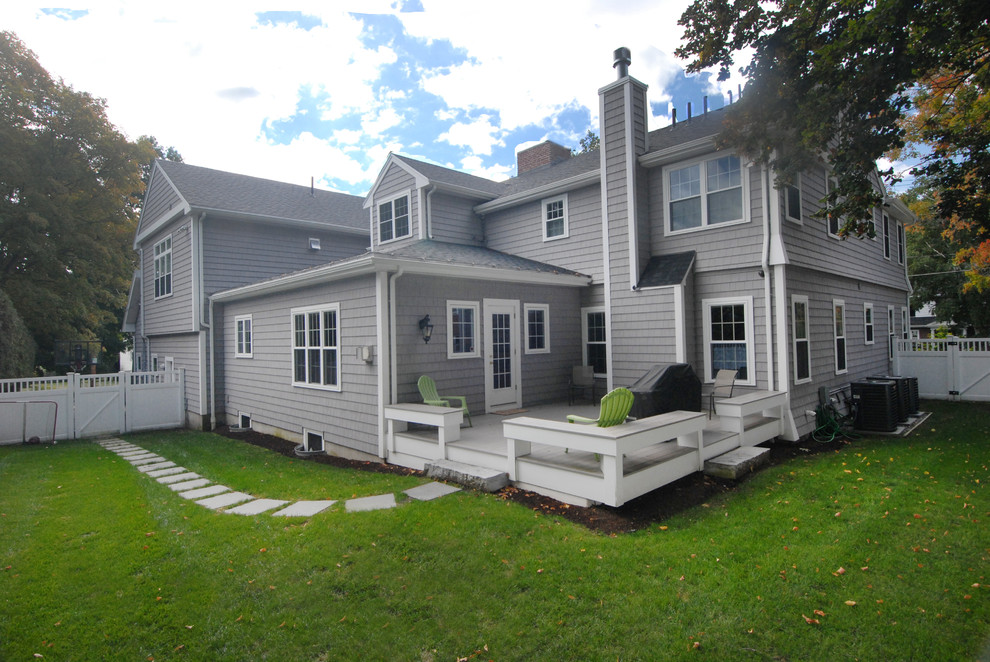 Photo of a large traditional two-storey grey exterior in Boston with vinyl siding.