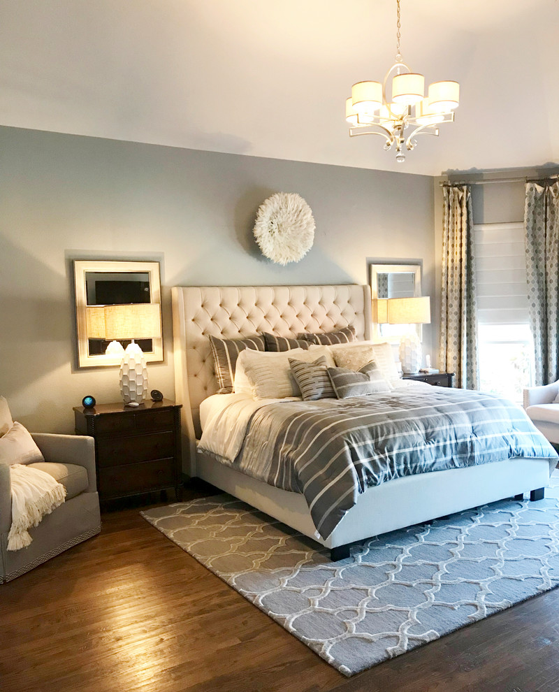 Design ideas for a large contemporary master bedroom in Dallas with medium hardwood floors and brown floor.