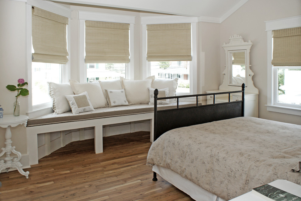 Photo of a beach style guest bedroom in DC Metro with medium hardwood floors.