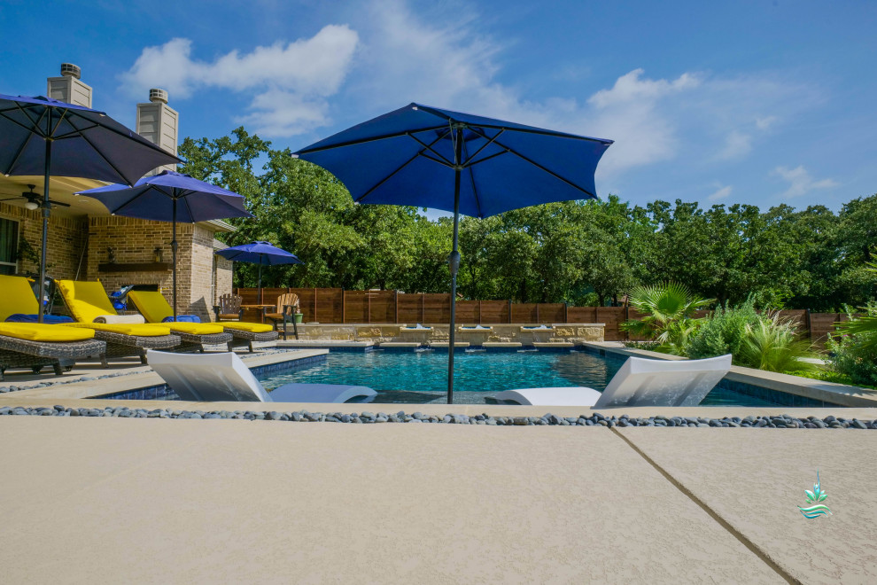 Inspiration for a huge mediterranean backyard custom-shaped infinity pool landscaping remodel in Dallas with decking