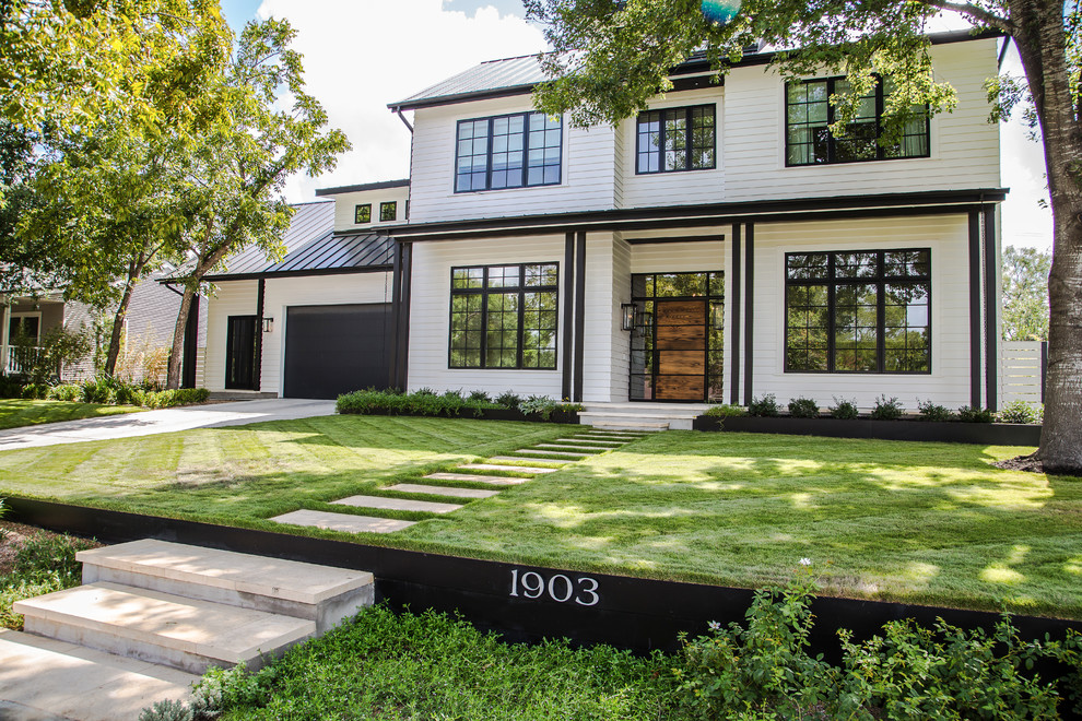 Design ideas for a traditional two-storey white exterior in Austin.