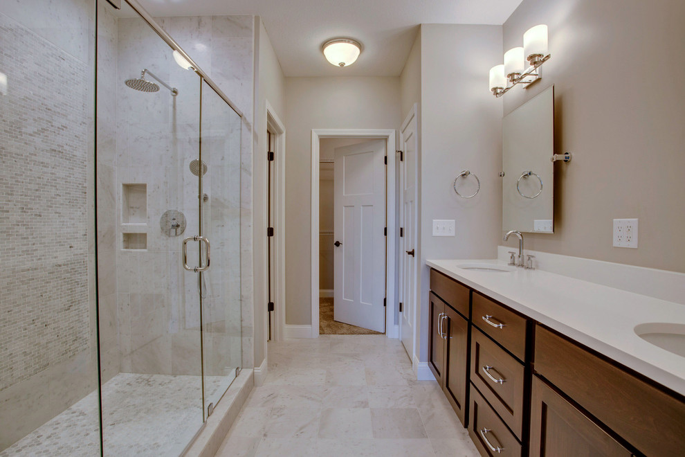 Example of a mid-sized transitional master gray tile and marble tile marble floor doorless shower design in Chicago with shaker cabinets, dark wood cabinets, gray walls, an undermount sink and quartz countertops
