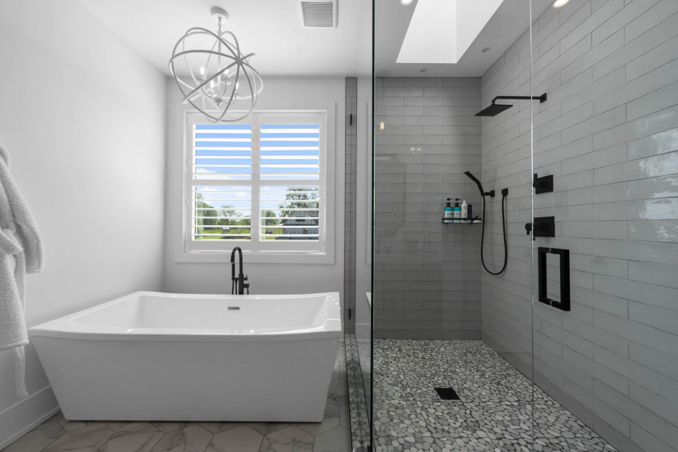 Photo of a large country master bathroom in Nashville with beaded inset cabinets, grey cabinets, a freestanding tub, a corner shower, a one-piece toilet, white walls, mosaic tile floors, a drop-in sink, engineered quartz benchtops, white floor, a hinged shower door, white benchtops, an enclosed toilet, a double vanity and a built-in vanity.