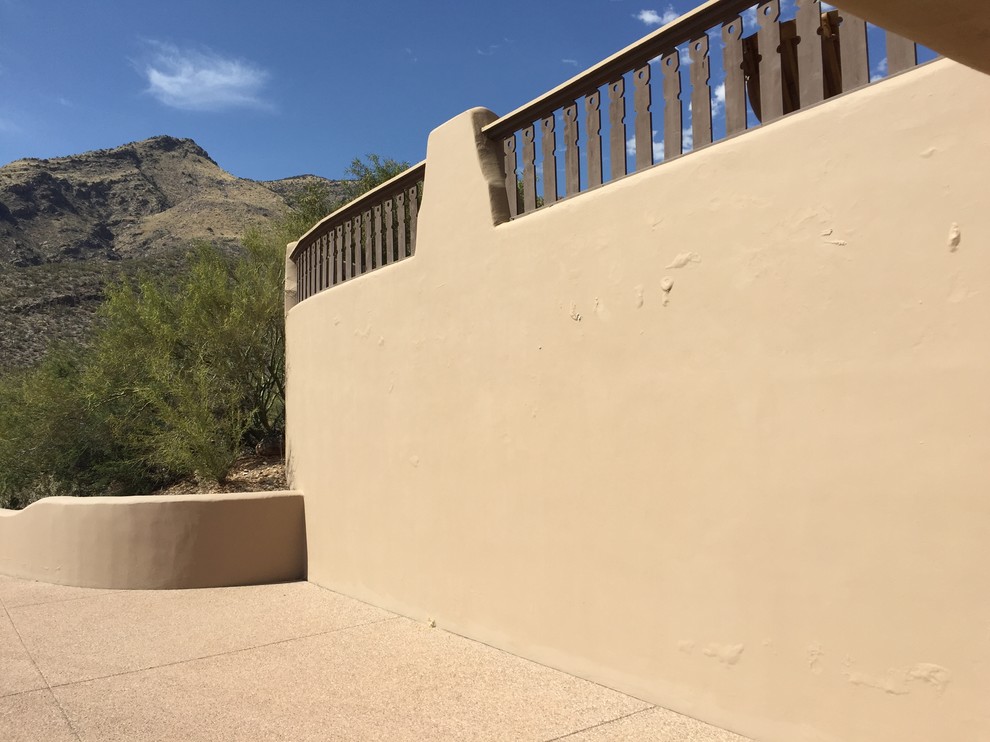 Painted stucco retaining wall (AZ)...now blistering
