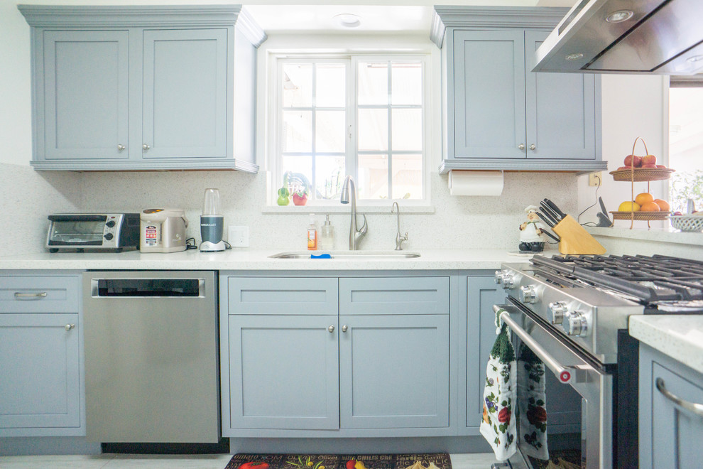 Enclosed kitchen - mid-sized transitional l-shaped porcelain tile and white floor enclosed kitchen idea with an undermount sink, shaker cabinets, gray cabinets, quartz countertops, white backsplash, stone slab backsplash, stainless steel appliances, no island and white countertops