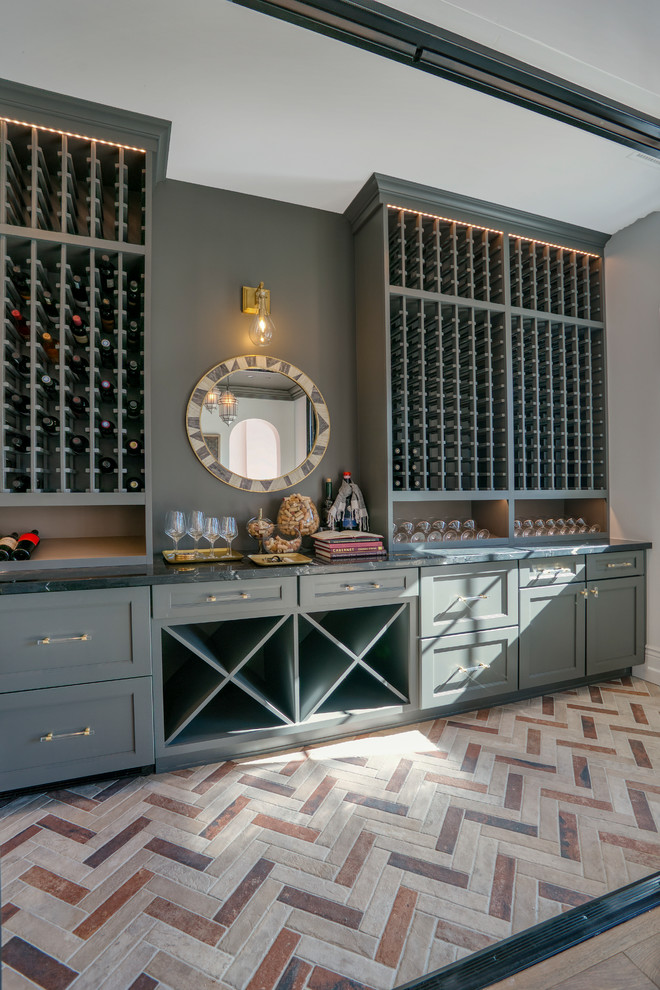 Photo of a mid-sized contemporary wine cellar in Phoenix with storage racks and multi-coloured floor.