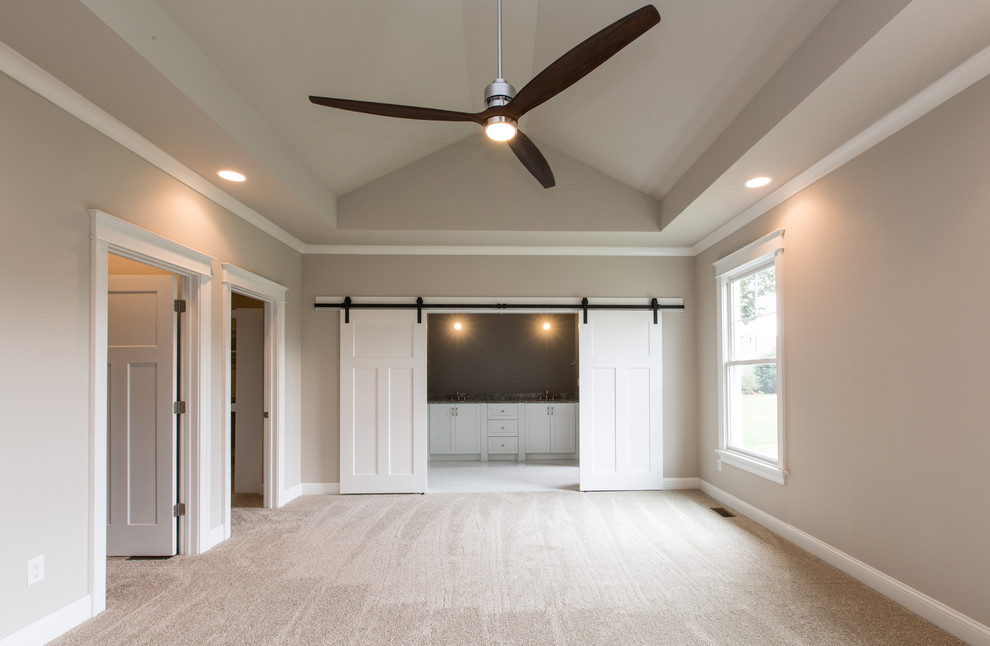 This is an example of a mid-sized arts and crafts master bedroom in Other with grey walls and carpet.