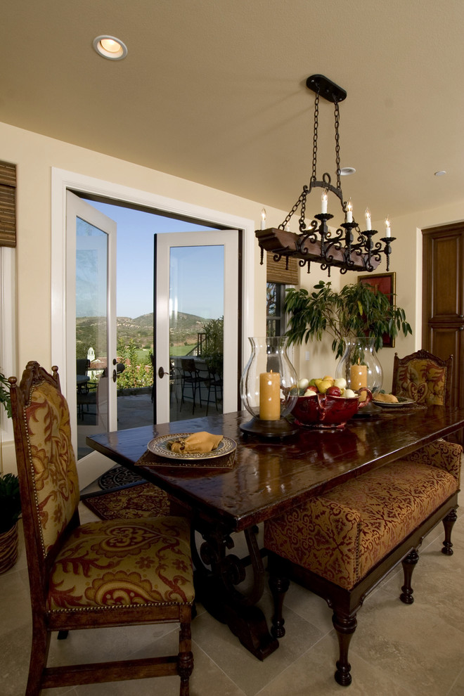 This is an example of a traditional dining room in Orange County with beige walls.
