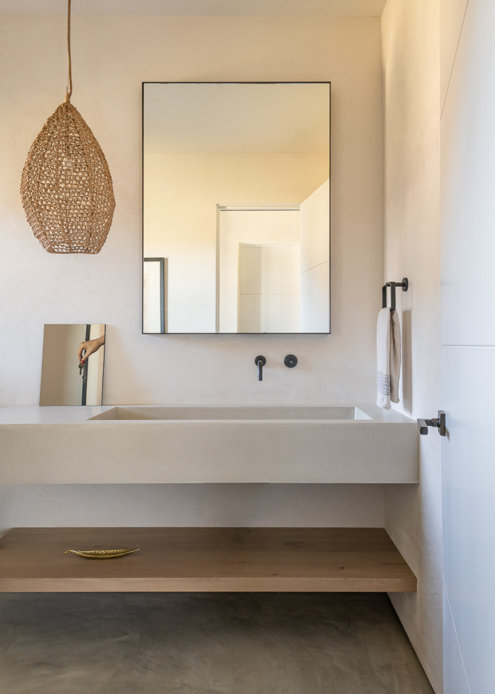 Design ideas for a contemporary cloakroom in Other with an integrated sink and concrete worktops.
