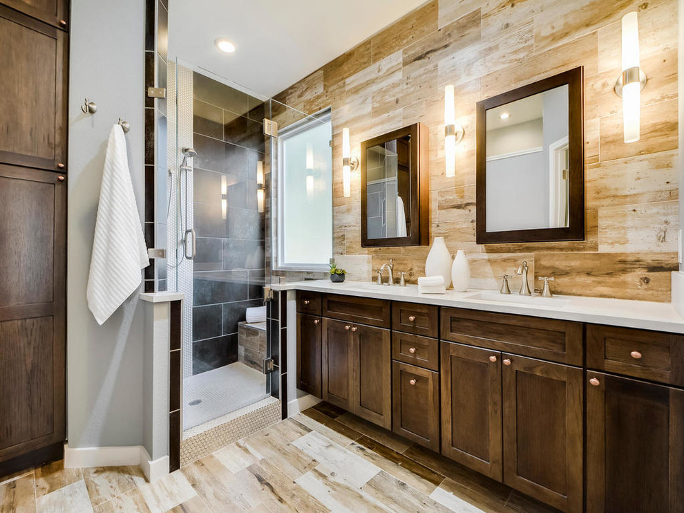 This is an example of a mid-sized transitional master bathroom in Austin with shaker cabinets, dark wood cabinets, a two-piece toilet, white tile, terra-cotta tile, multi-coloured walls, travertine floors, a drop-in sink and engineered quartz benchtops.