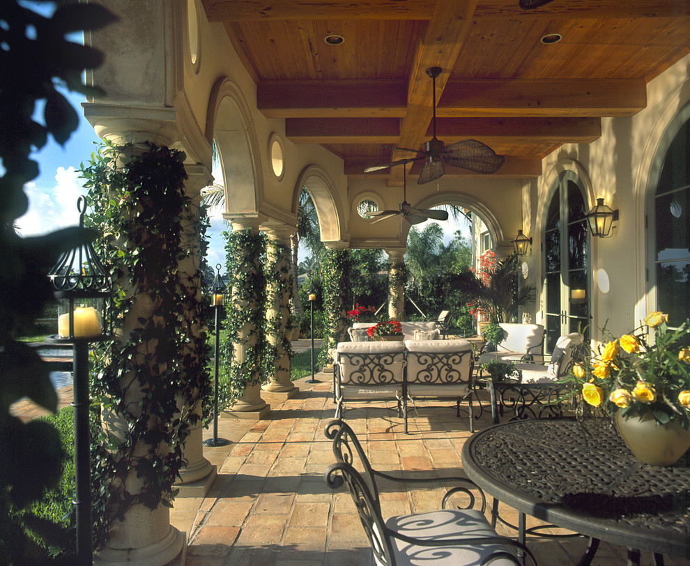 Inspiration for a mediterranean patio in Miami with brick pavers.