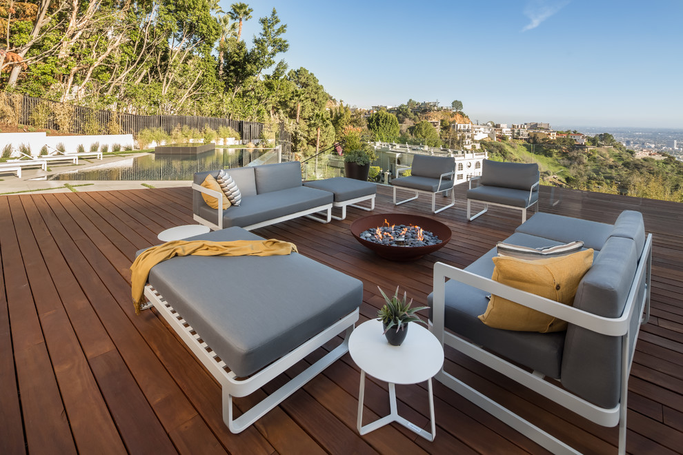This is an example of a contemporary rooftop and rooftop deck in Los Angeles with a fire feature and no cover.