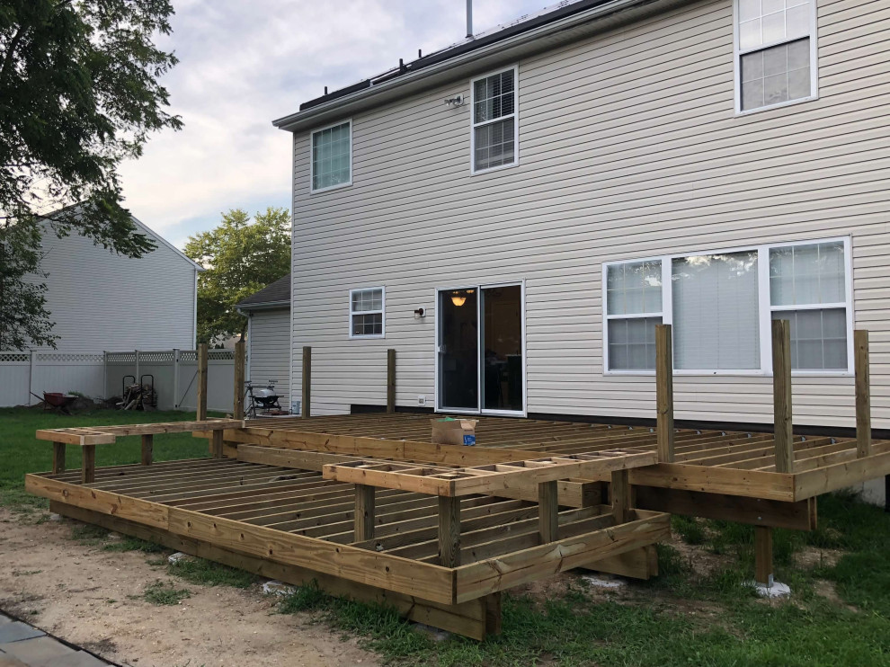 Large elegant backyard deck photo