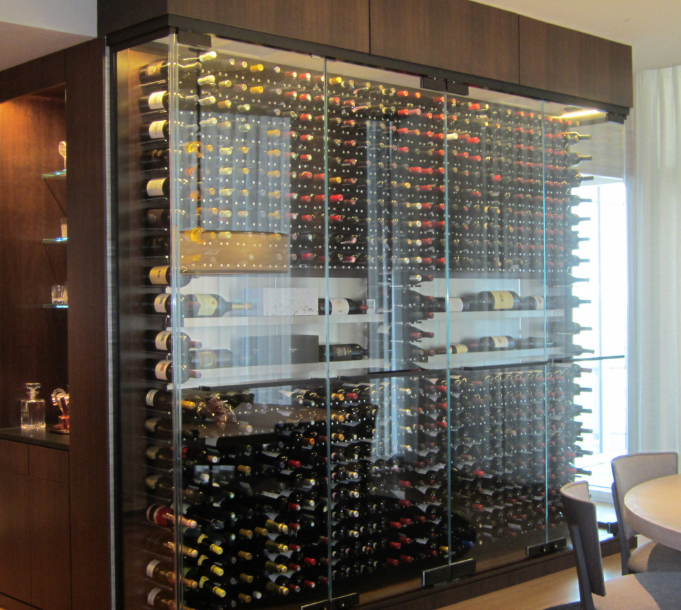 This is an example of a small modern wine cellar in Dallas.