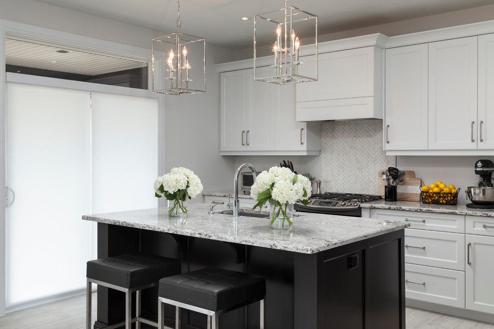 Eat-in kitchen - mid-sized transitional single-wall ceramic tile eat-in kitchen idea in Toronto with an undermount sink, shaker cabinets, gray cabinets, solid surface countertops, ceramic backsplash, stainless steel appliances and an island