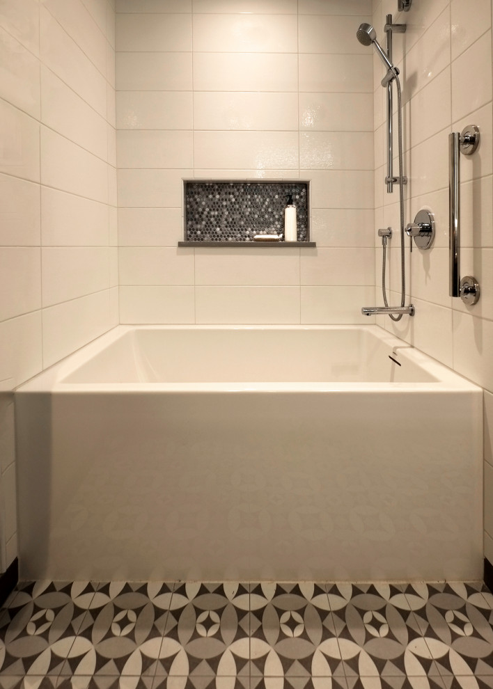 This is an example of a small contemporary master bathroom in Seattle with grey cabinets, an alcove tub, a shower/bathtub combo, a one-piece toilet, multi-coloured tile, porcelain tile, grey walls, mosaic tile floors, a vessel sink, engineered quartz benchtops, multi-coloured floor, a shower curtain and white benchtops.