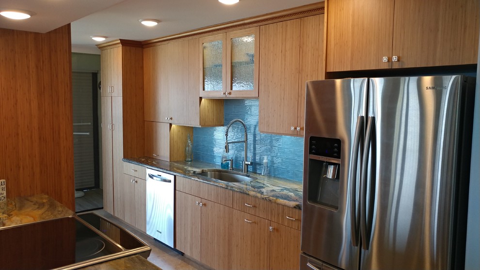 Photo of a large contemporary galley open plan kitchen in Tampa with a single-bowl sink, flat-panel cabinets, medium wood cabinets, quartzite benchtops, blue splashback, glass tile splashback, stainless steel appliances, porcelain floors and no island.