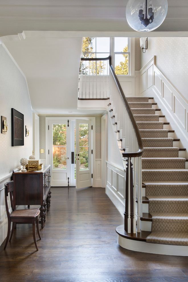 Atherton Residence - Inspiration for a mid-sized timeless dark wood floor and brown floor front door remodel in San Francisco with beige walls and a white front door