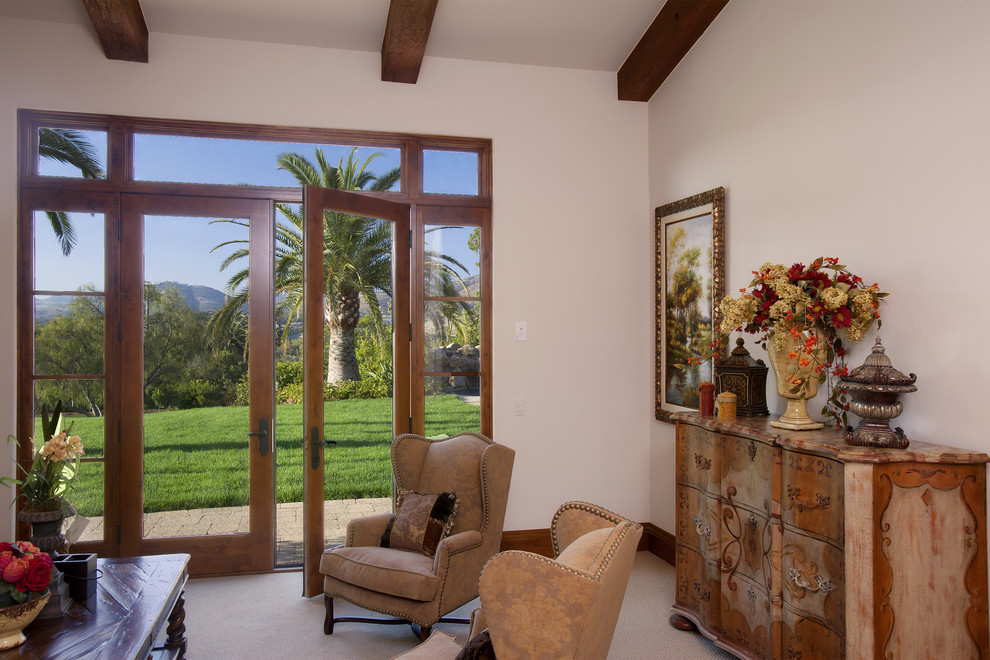 This is an example of a traditional living room in San Diego with white walls.